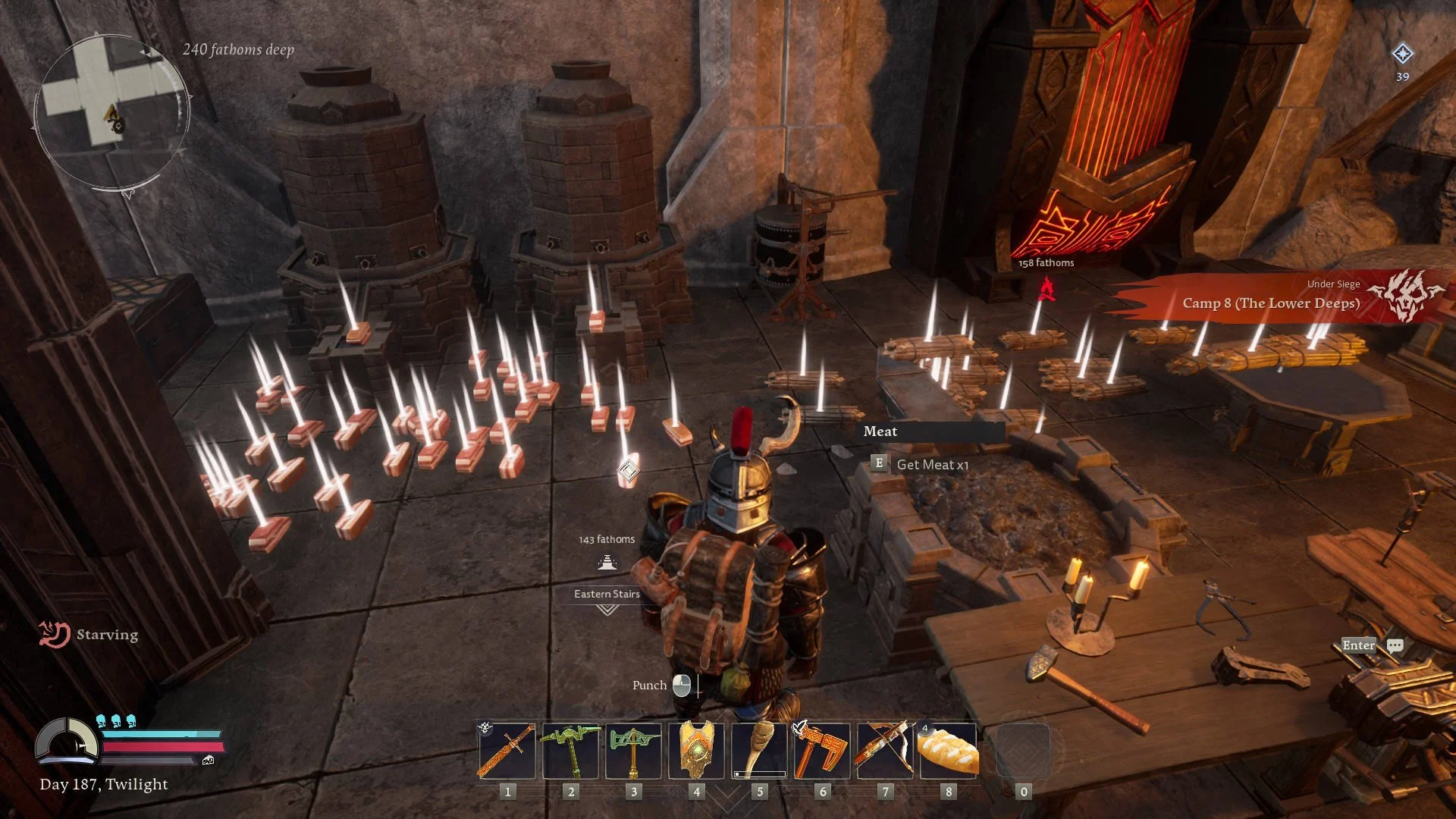 The Lord of the Rings: Return to Moria gameplay screenshot showing a camp under siege in the Lower Deeps, with piles of loot, meat pickups, hearths, and storage near a red dwarven gate.